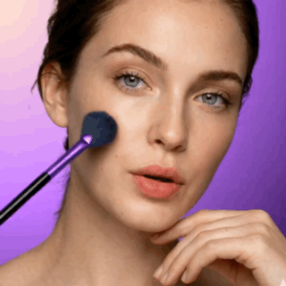 professional model facial highlighting application on cheekbones with veraVia fan blending brush