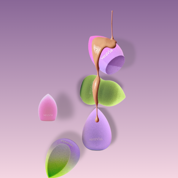 veraVia aurora series beauty sponges with smooth liquid foundation pouring over on purple background