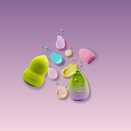 veraVia blush harmony beauty sponges with colorful liquid foundation splashes on purple background